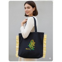 Bolsa negra Mimosa con volantes